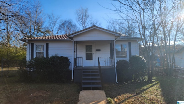 view of front of house with a standing seam roof and metal roof