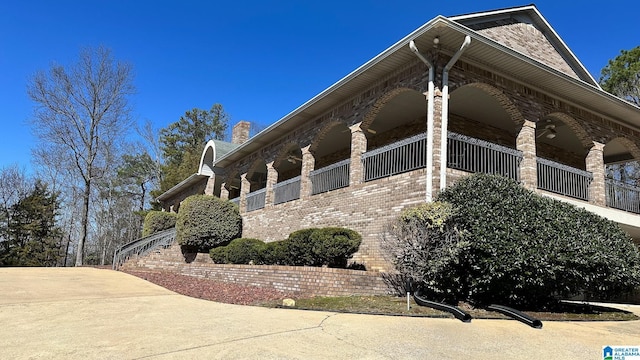 view of home's exterior with brick siding