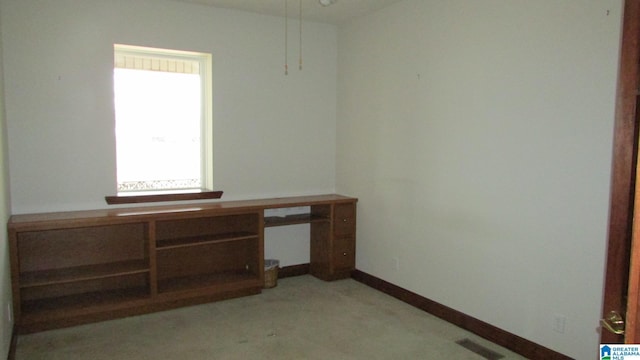 unfurnished office with visible vents and baseboards