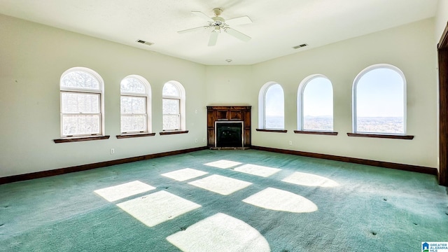 unfurnished living room featuring light colored carpet, visible vents, and baseboards