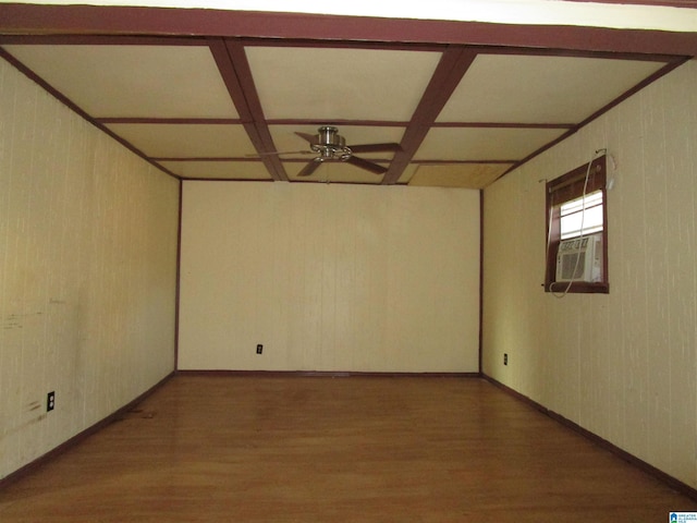 unfurnished room with cooling unit, coffered ceiling, dark wood finished floors, and ceiling fan