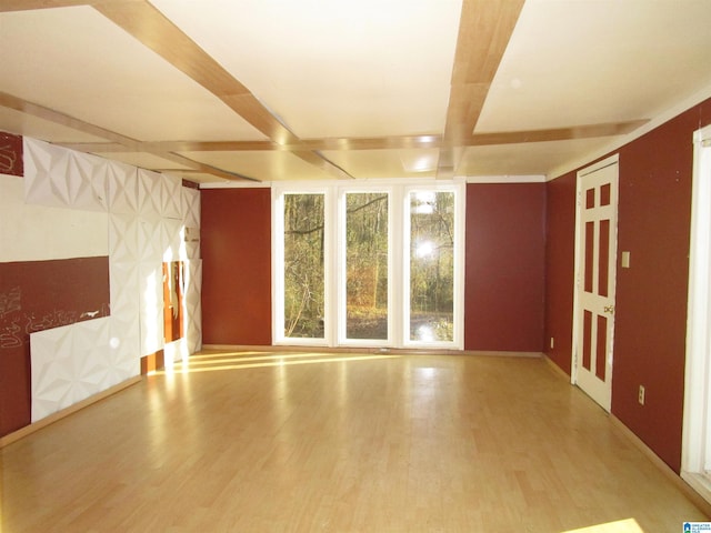 spare room featuring wood finished floors