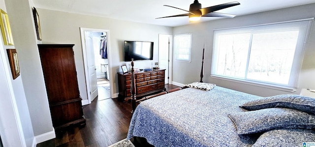 bedroom featuring ceiling fan, baseboards, and dark wood finished floors