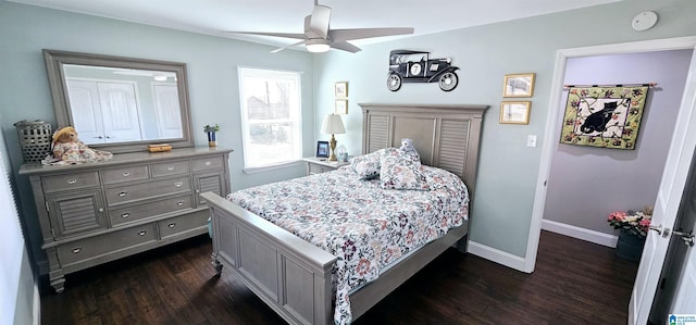 bedroom featuring a ceiling fan, baseboards, and dark wood-style flooring