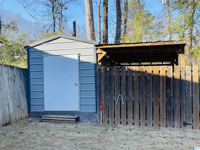 view of shed featuring fence