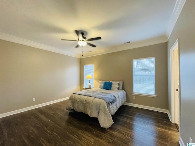 bedroom featuring baseboards, dark wood-type flooring, and crown molding