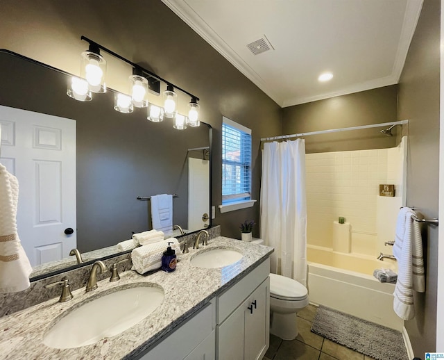 bathroom with crown molding, visible vents, a sink, and tile patterned floors