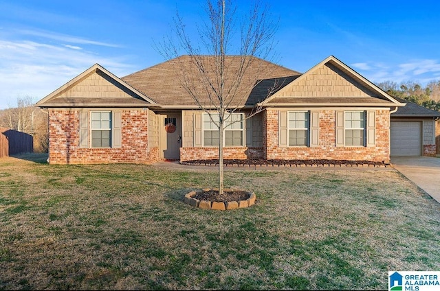 view of front facade featuring brick siding, a front yard, and fence