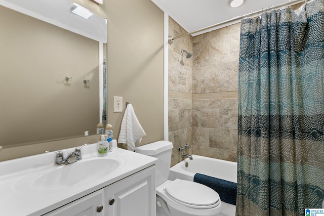 full bath with shower / bath combination with curtain, vanity, and toilet