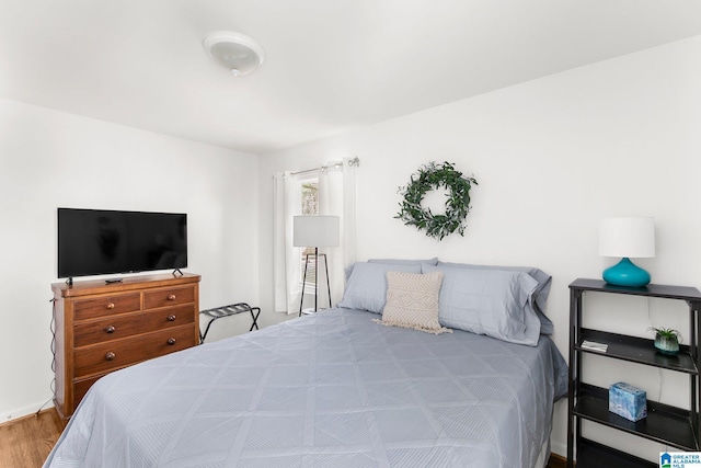 bedroom featuring wood finished floors