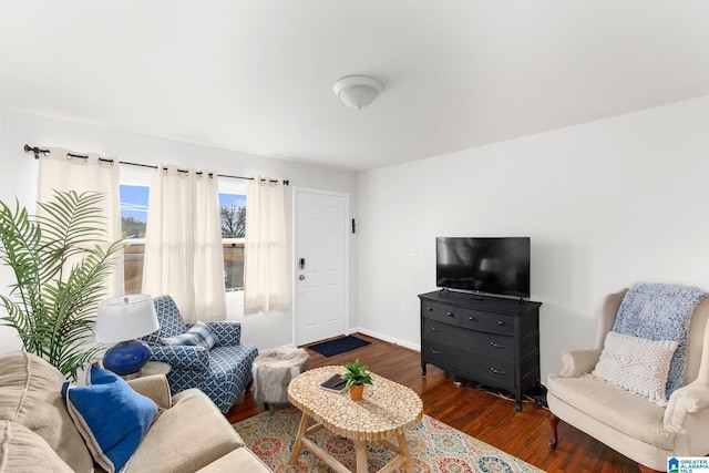 living area with dark wood finished floors and baseboards