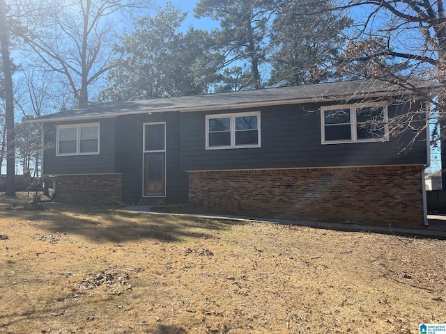 view of front of house featuring brick siding