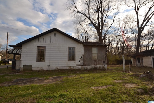 view of home's exterior with a yard