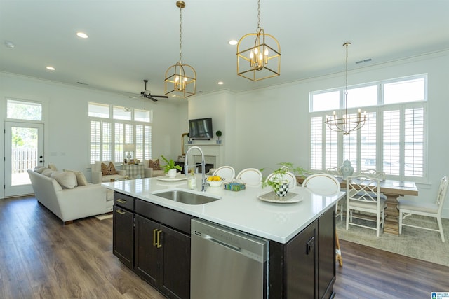 kitchen featuring ornamental molding, stainless steel dishwasher, a sink, and dark wood finished floors