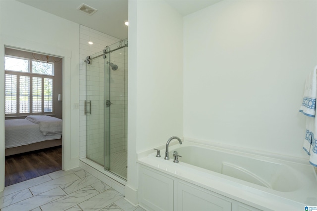 full bathroom with marble finish floor, visible vents, a shower stall, and a bath