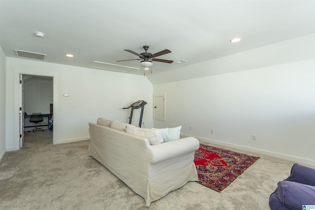 living area featuring recessed lighting, light colored carpet, visible vents, baseboards, and electric panel