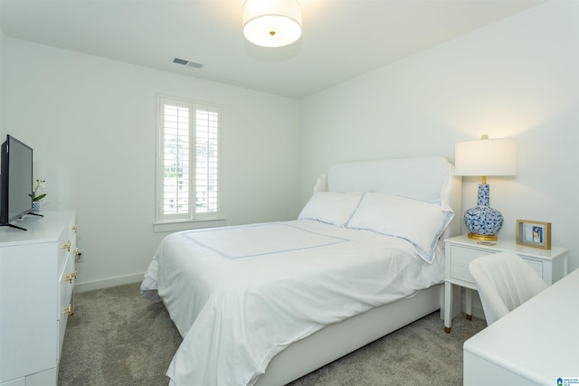 bedroom featuring light colored carpet, visible vents, and baseboards