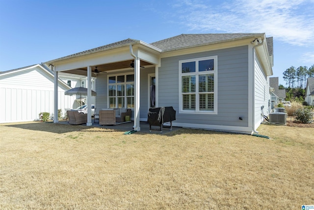 rear view of property with central AC unit, a lawn, a ceiling fan, a patio, and an outdoor hangout area