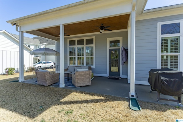 view of patio / terrace with a ceiling fan, fence, area for grilling, and an outdoor hangout area