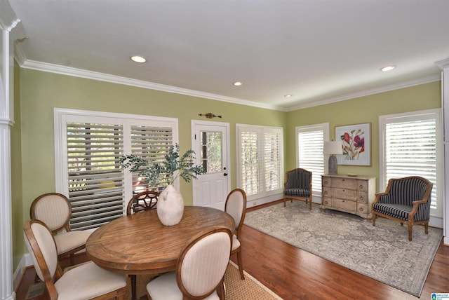 dining space with recessed lighting, wood finished floors, and crown molding