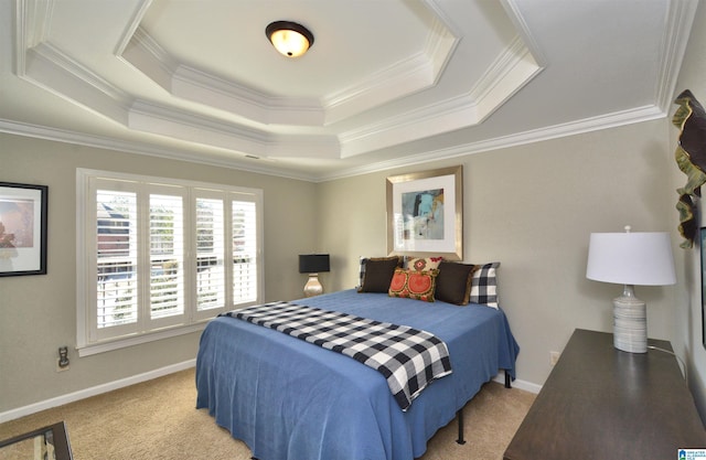 bedroom with light carpet, baseboards, a tray ceiling, and crown molding