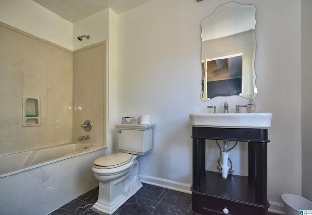 bathroom with toilet, marble finish floor, baseboards, and shower / washtub combination