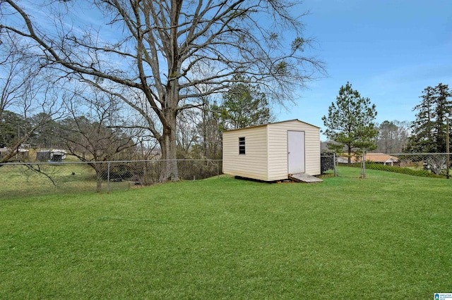 view of yard with a storage shed, a fenced backyard, and an outdoor structure