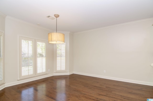 empty room with baseboards, crown molding, visible vents, and dark wood-style flooring