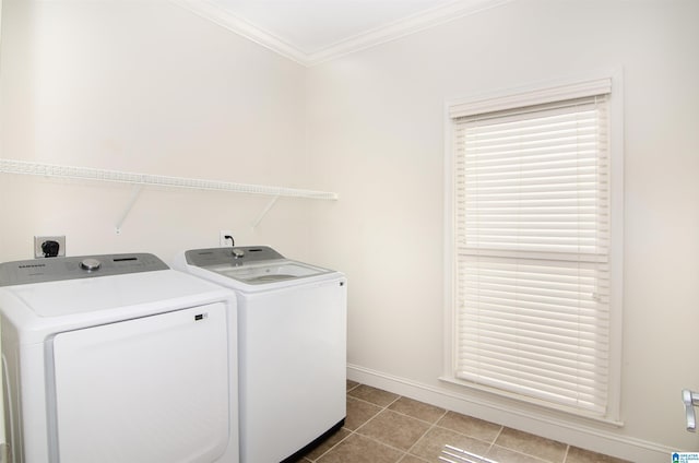 washroom with tile patterned flooring, laundry area, separate washer and dryer, a healthy amount of sunlight, and ornamental molding