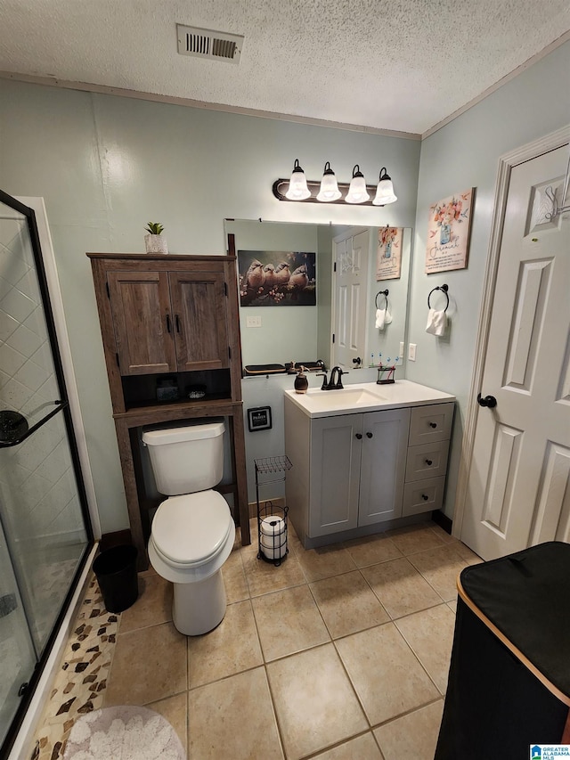 full bath featuring toilet, tile patterned flooring, vanity, and visible vents