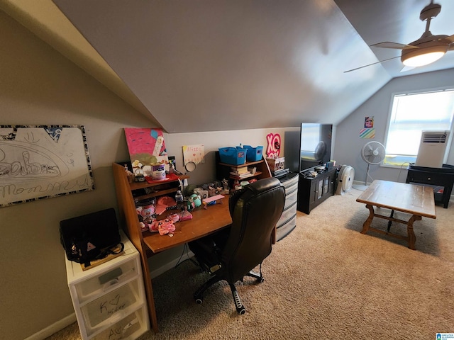 office area with vaulted ceiling, carpet, a ceiling fan, and baseboards