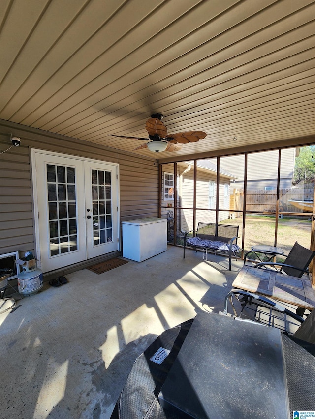 view of patio featuring ceiling fan, fence, and french doors