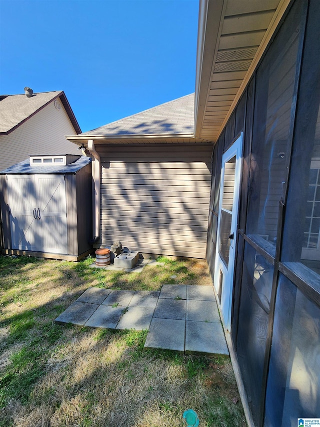 exterior space with an outbuilding, a yard, and a shed