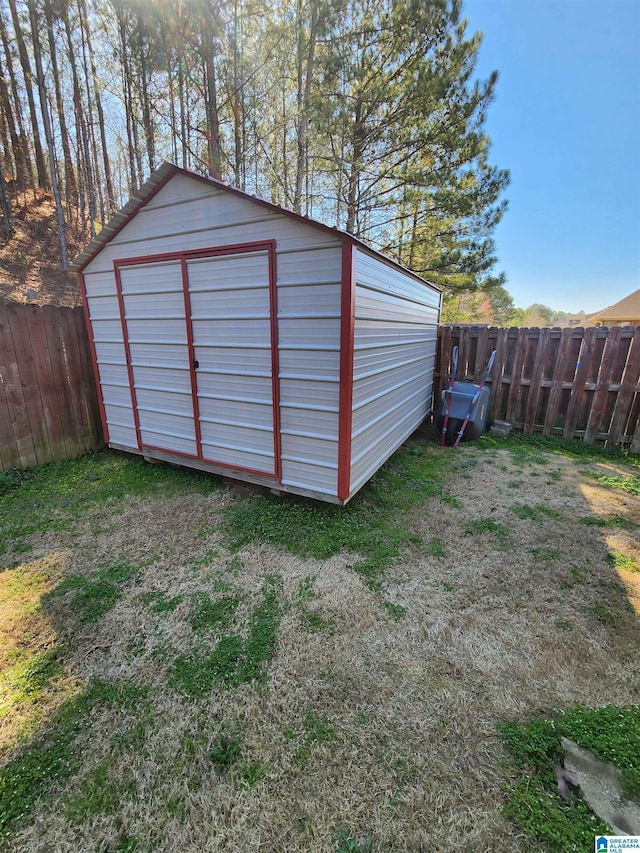 view of shed with a fenced backyard