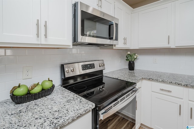 kitchen with stainless steel appliances and white cabinetry