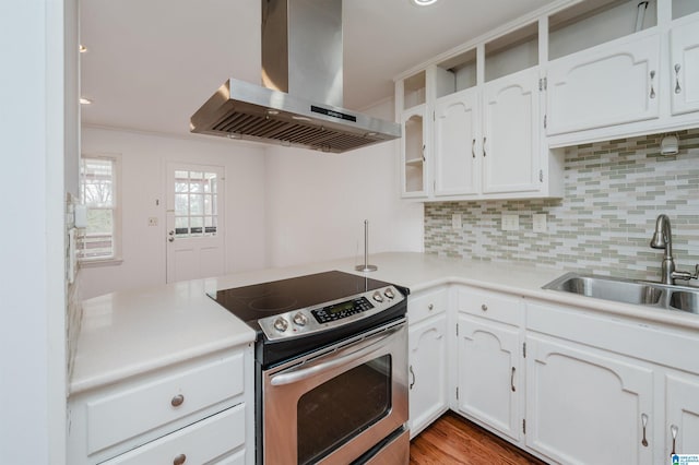 kitchen featuring a sink, white cabinetry, electric stove, light countertops, and island exhaust hood