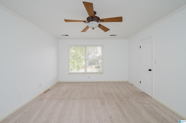 unfurnished room featuring light carpet, ornamental molding, and visible vents