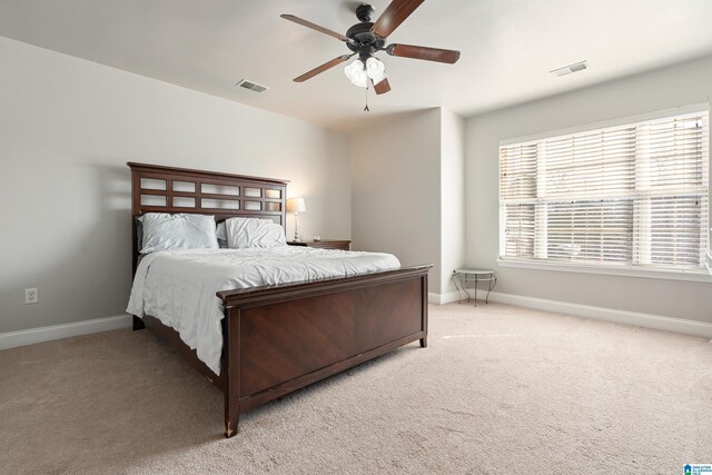 bedroom featuring visible vents, baseboards, and carpet floors