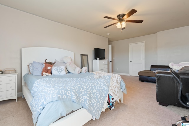 carpeted bedroom with baseboards and ceiling fan