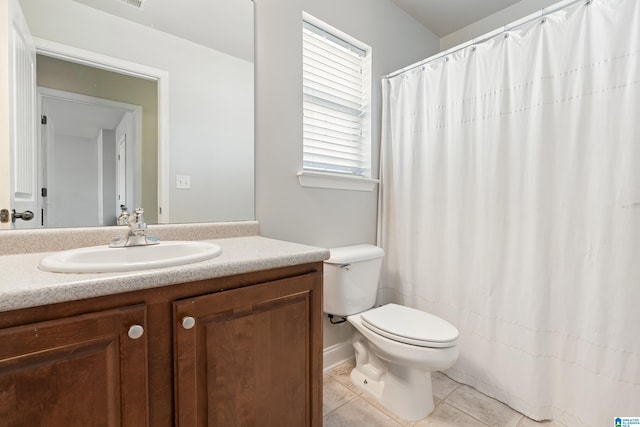 full bath featuring a shower with curtain, toilet, vanity, and tile patterned flooring