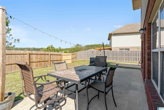 view of patio / terrace with outdoor dining area and a fenced backyard