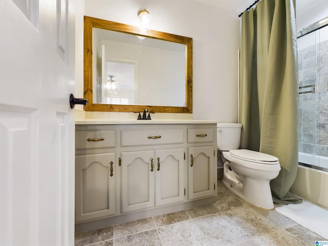 bathroom with shower / bath combo, vanity, and toilet