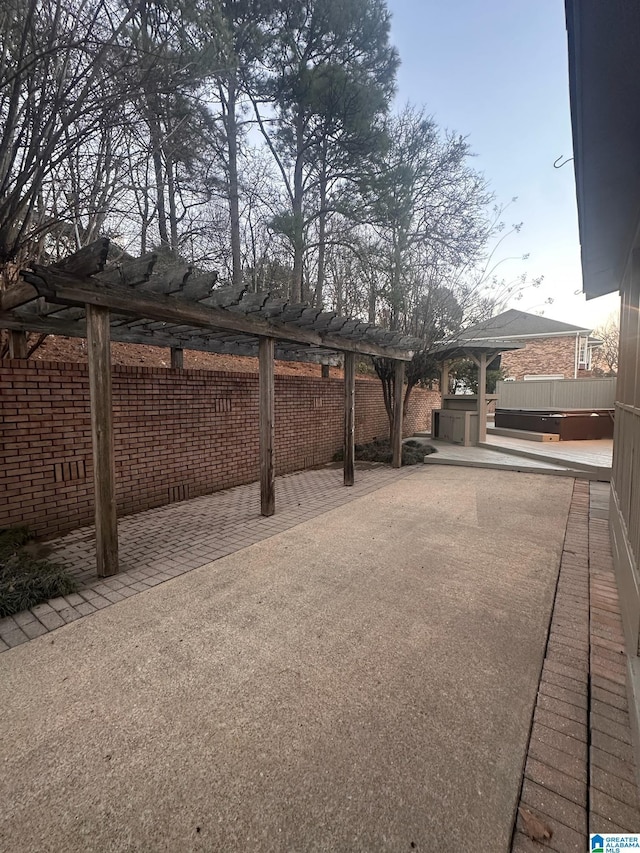 exterior space with fence and a pergola