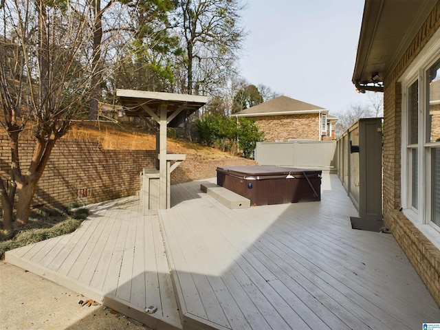 deck with a hot tub