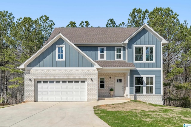 view of front of home with brick siding, roof with shingles, concrete driveway, an attached garage, and board and batten siding