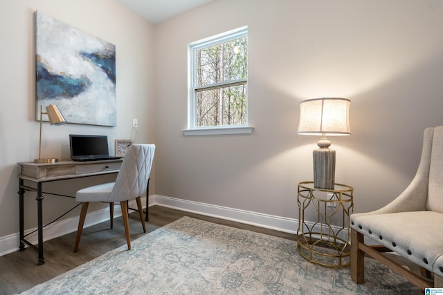 office area featuring baseboards and wood finished floors