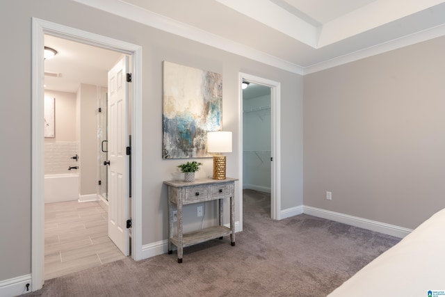 hall featuring carpet floors and baseboards