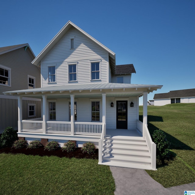 farmhouse-style home featuring a front lawn, covered porch, metal roof, and a standing seam roof