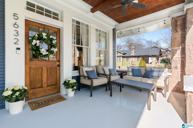 view of patio with ceiling fan and a porch