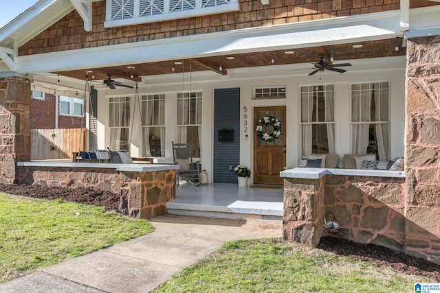 doorway to property with ceiling fan, a bar, and fence